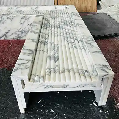white marble fireplace of Arabescato