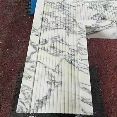 white marble fireplace of Arabescato